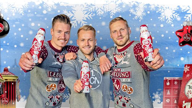 Manuel Schäffler, Pascal Köpke und Hanno Behrens präsentieren den neuen Ugly-Christmas-Sweater im Club-Design.