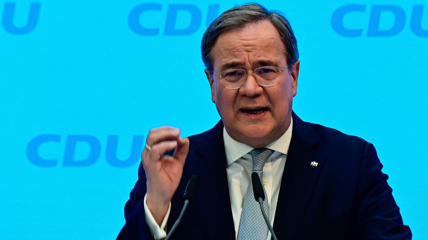 Armin Laschet, head of Germany's conservative Chritian Democratic Union (CDU) party, gives a press statement at the start of the participation campaign for the CDU election program for the general elections, in Berlin on March 30, 2021. (Photo by Tobias Schwarz / various sources / AFP) Armin Laschet, head of Germany's conservative Chritian Democratic Union (CDU) party, gives a press statement at the start of the participation campaign for the CDU election program for the general elections, in Berlin on March 30, 2021. (Photo by Tobias Schwarz / various sources / AFP)