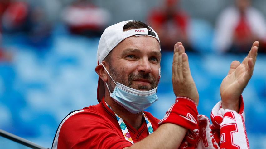 A Poland supporter waits for the start of the UEFA EURO 2020 Group E football match between Poland and Slovakia at the Saint Petersburg Stadium in Saint Petersburg on June 14, 2021. (Photo by EVGENIA NOVOZHENINA / various sources / AFP)