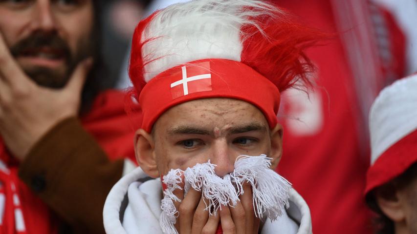 Fans react after Denmark's midfielder Christian Eriksen collapsed during the UEFA EURO 2020 Group B football match between Denmark and Finland at the Parken Stadium in Copenhagen on June 12, 2021. (Photo by Jonathan NACKSTRAND / POOL / AFP)