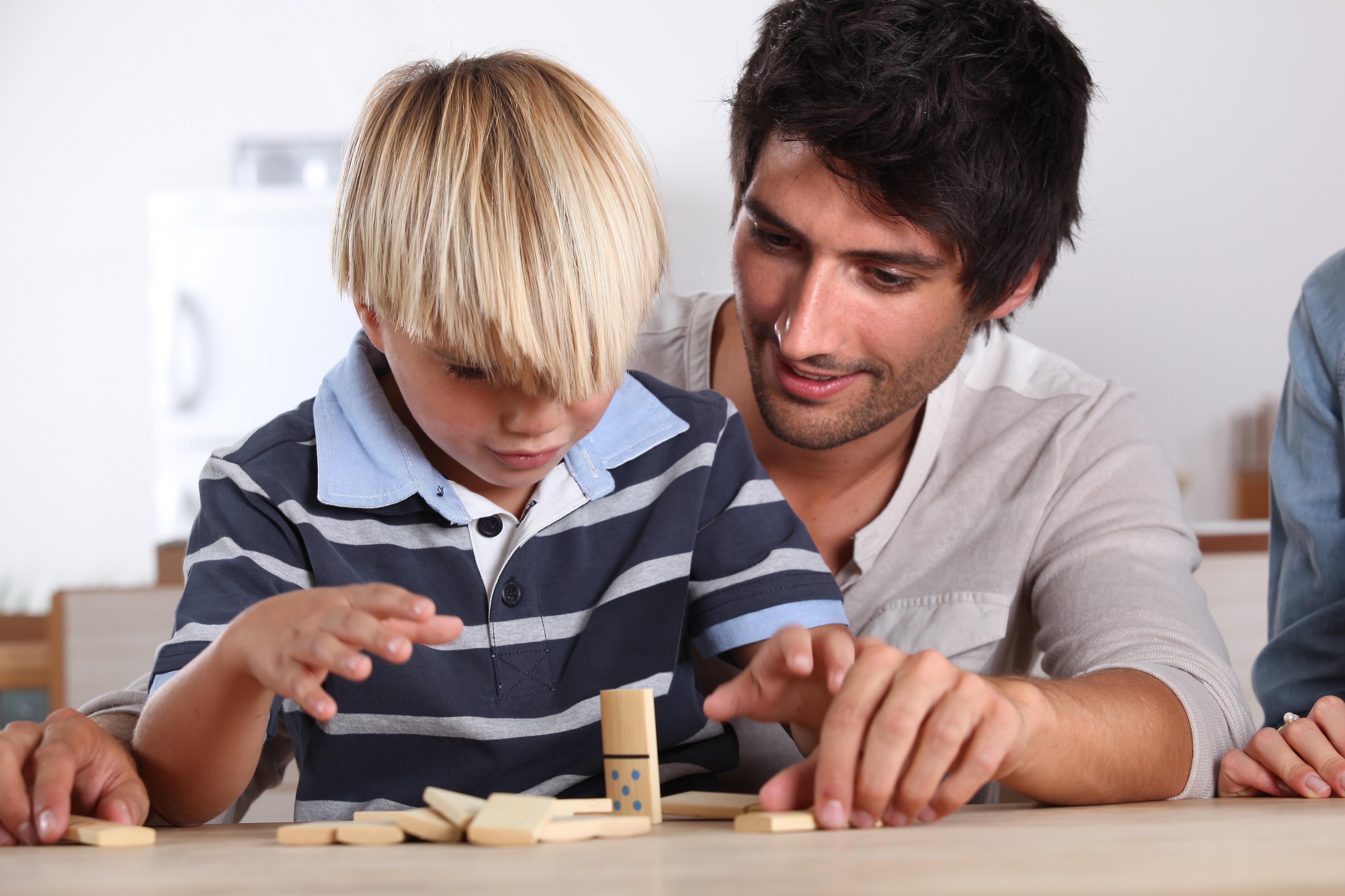 Father and son playing domino
