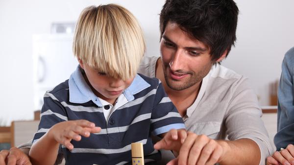 Father and son playing domino