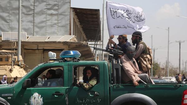 Afghanistan Taliban 6626211 16.08.2021 Taliban fighters ride on a vehicle in Kabul, Afghanistan. The Taliban (designated