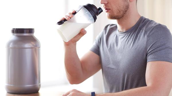 man drinking protein shake