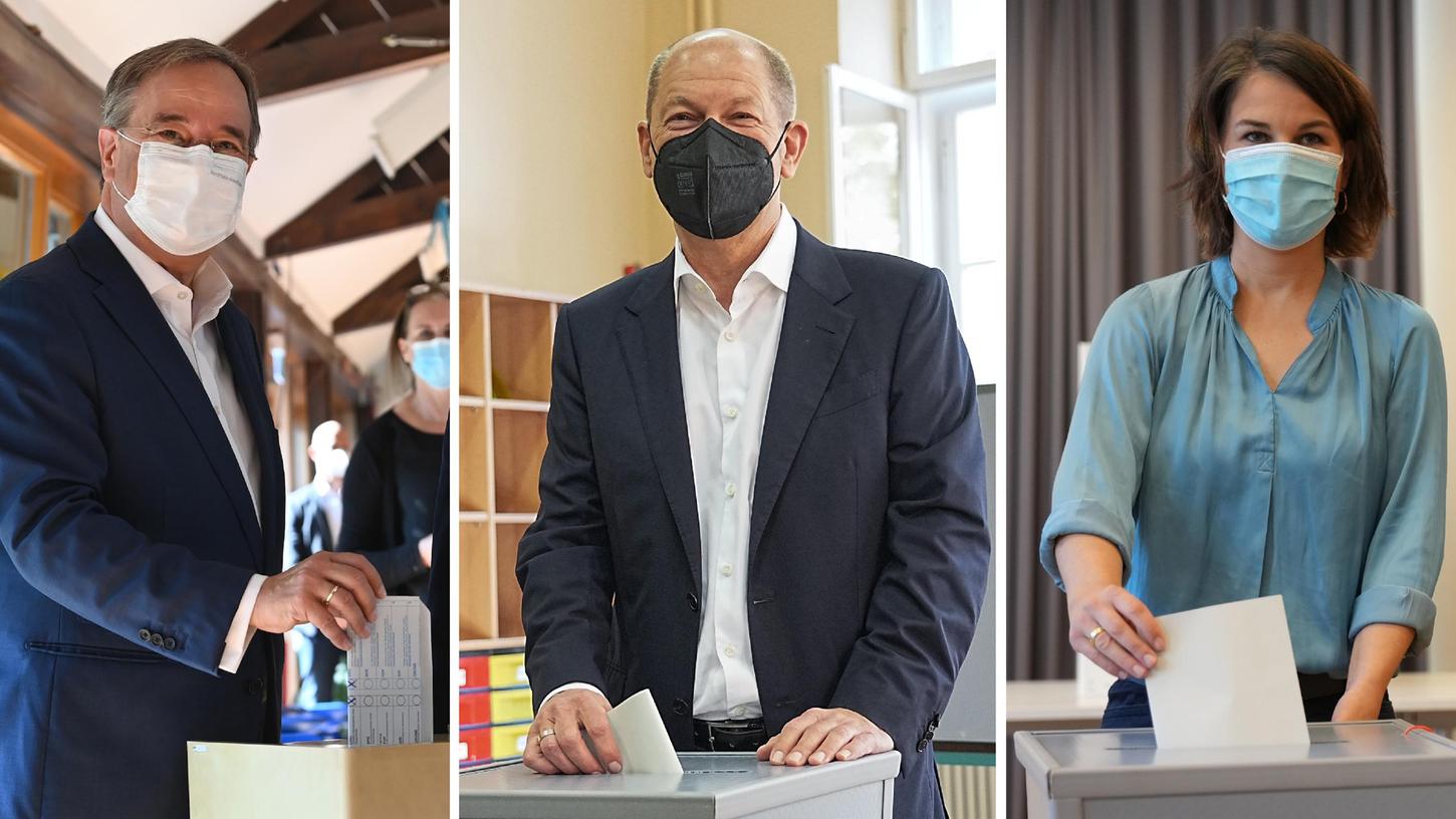 Die drei Kanzlerkandidaten bei der Stimmabgabe. Wer wird am Ende die Regierung führen?