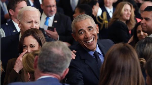 Former President Barack Obama greets well-wishers at an event on the Affordable Care Act and lowering health care costs