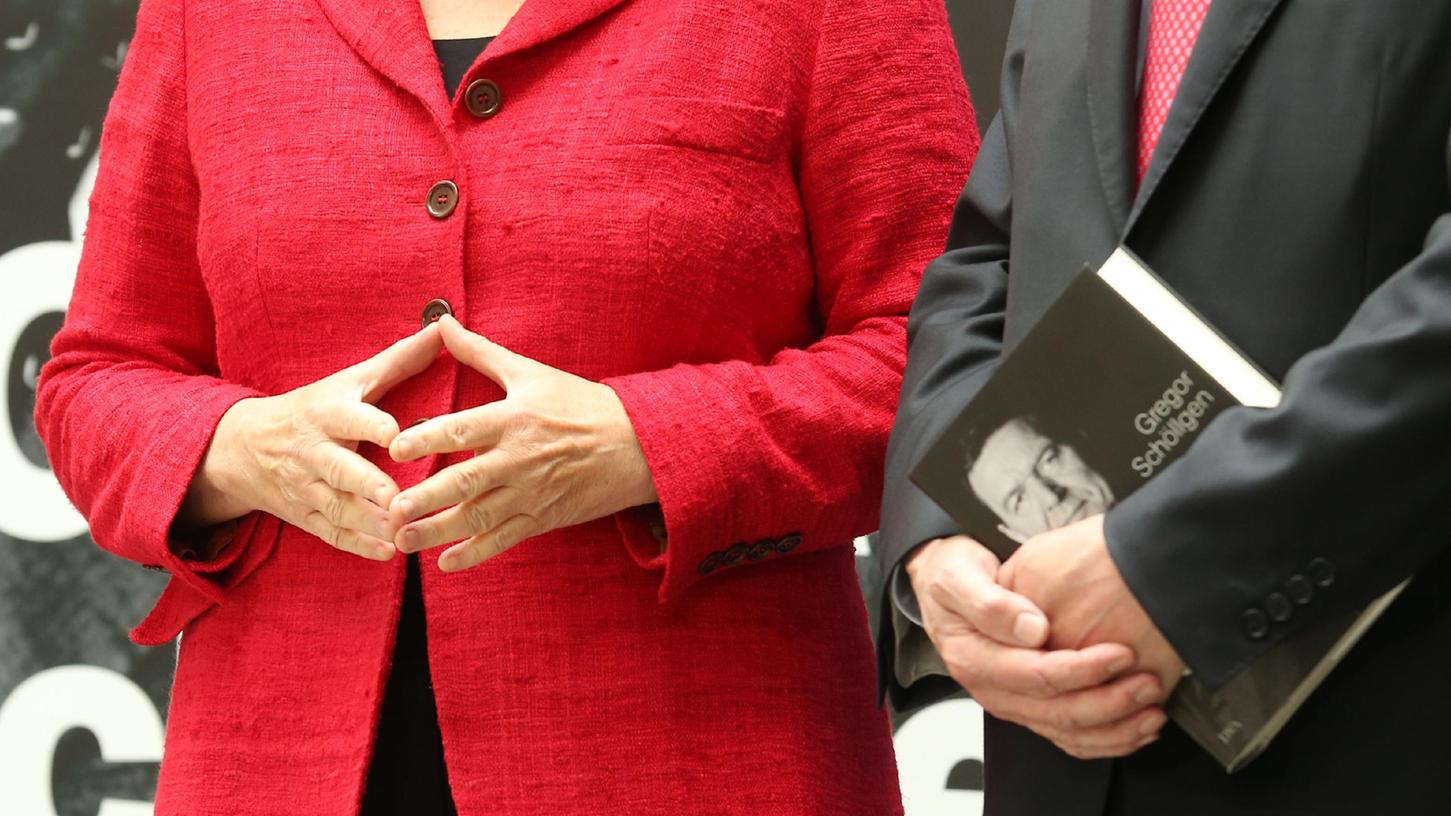 Eine Geste, die für eine ganze Ära spricht: Angela Merkels Raute.
Eine Geste, die für eine ganze Ära spricht: Angela Merkels Raute.