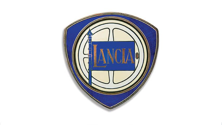 Schon damals mit Lenkrad, Lanze und Flagge auf dreieckigem Schild: Lancia-Logo aus dem Jahr 1929. 