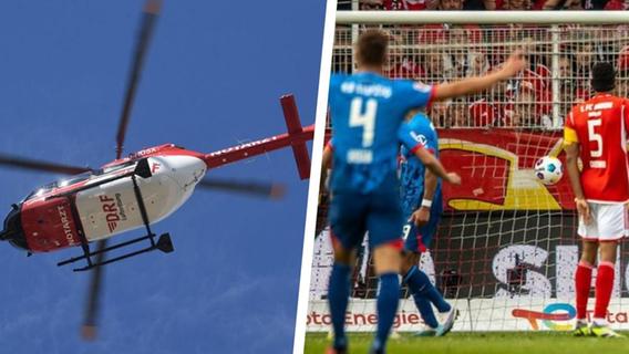 Plötzlich Totenstille: Heli-Einsatz während Bundesliga-Topspiel - medizinischer Notfall