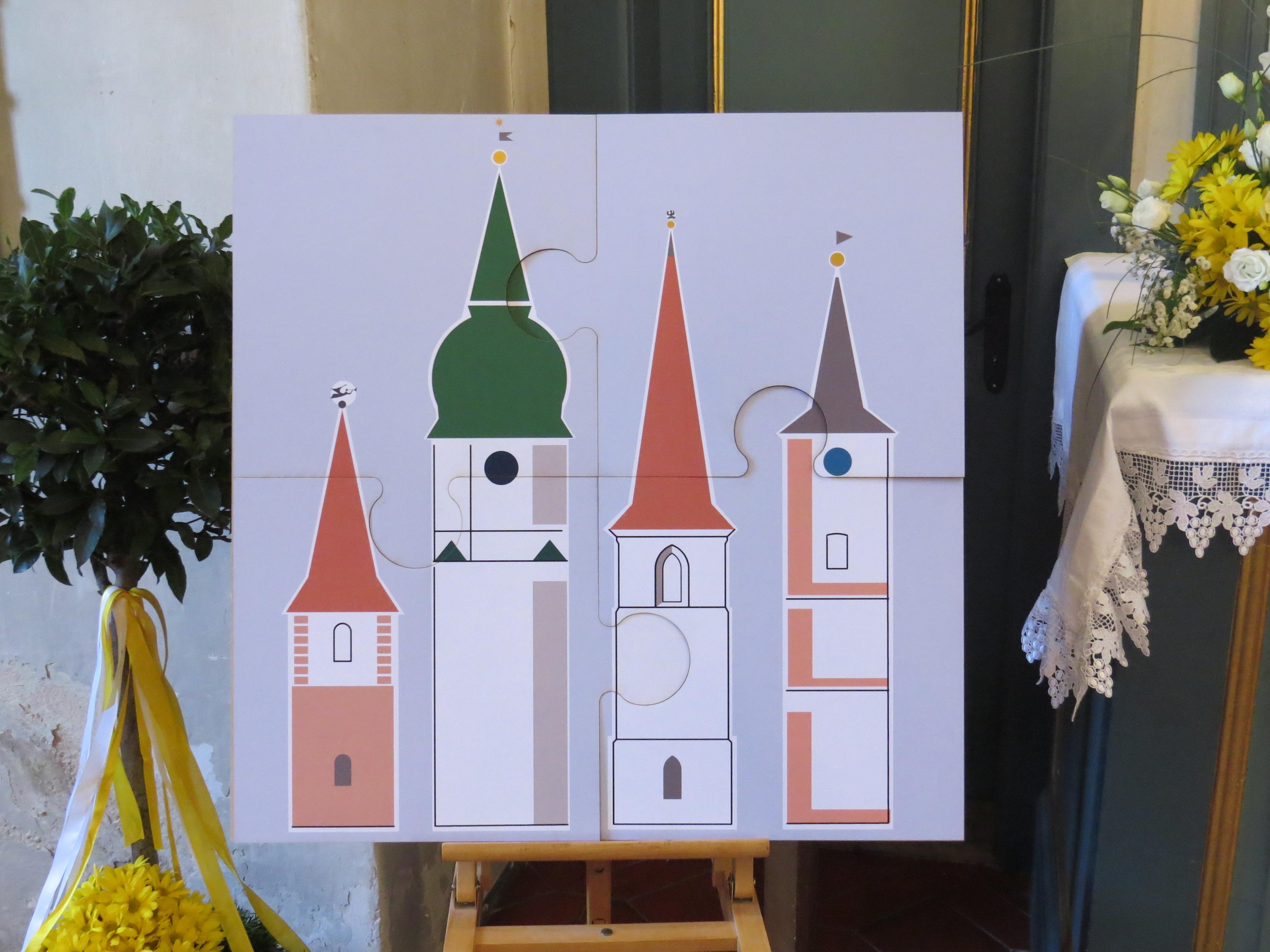 Das Kirchen-Puzzle, aus dem die Pfarrei besteht: Die Türme von St. Oswald, Mäbenberg, St. Georg, Georgensgmünd, St. Marien, Rittersbach, St. Peter, Petersgmünd (v.l.n.r.) als Quartett vereint.                      