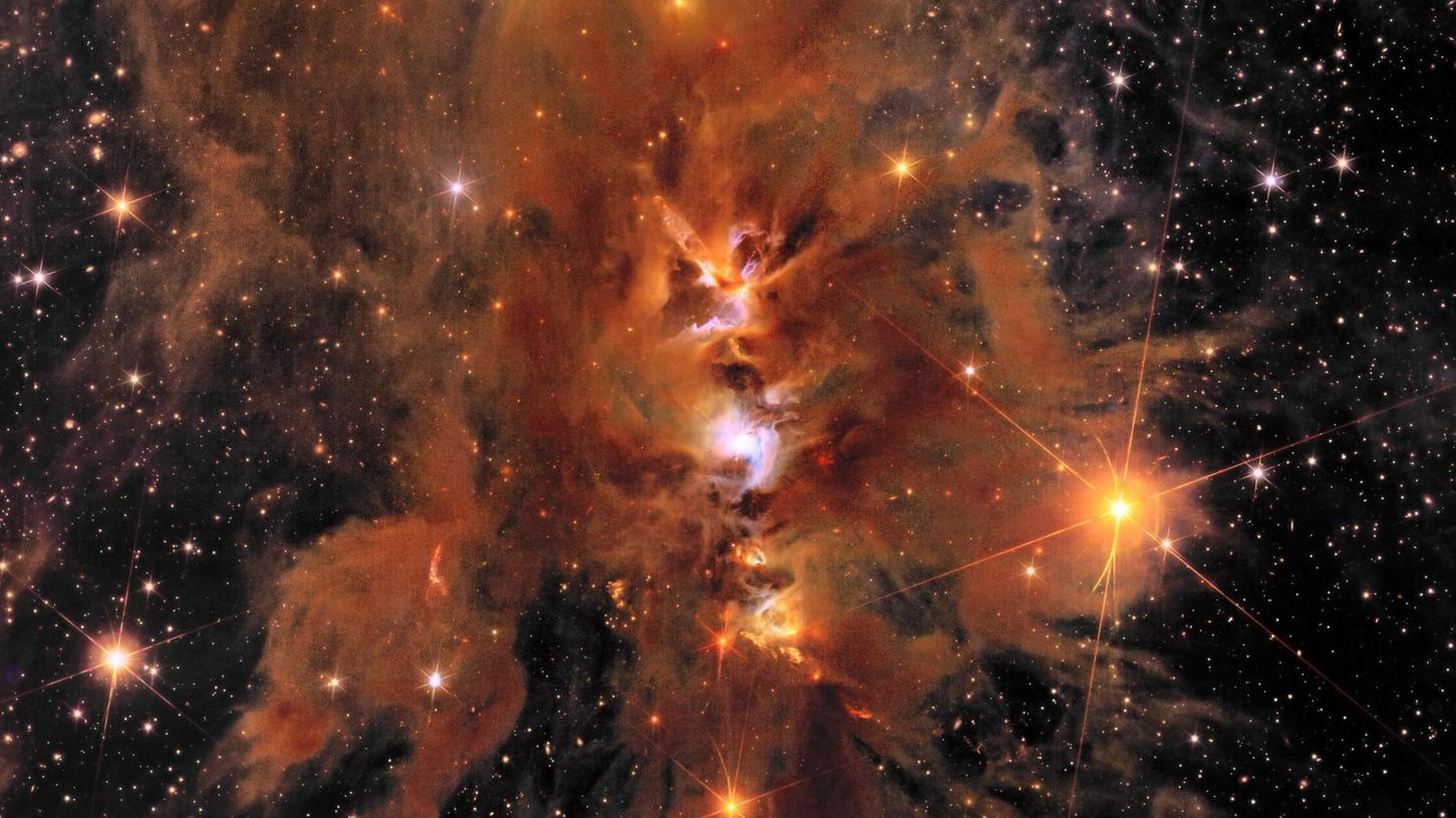 "Messier 78": ein leuchtender, von interstellarem Staub umhüllter Sternhaufen.