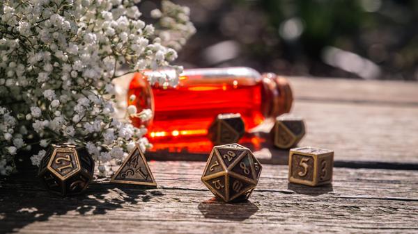 Low angle shot of a Bronze Role Playing dice set