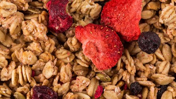 Muesli cereals close up background with raisins,