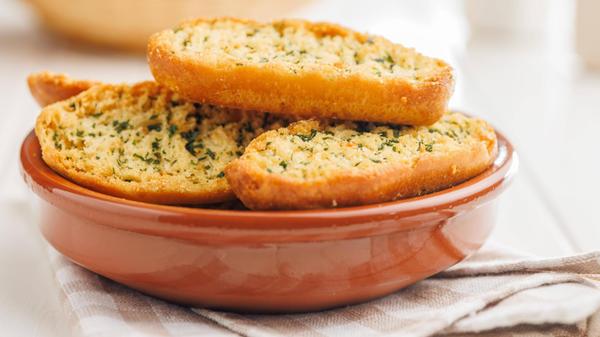 Garlic crisp bread Slices Topped With Herbs in bow