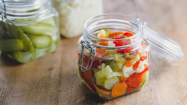 Pickled vegetables in glass jars
