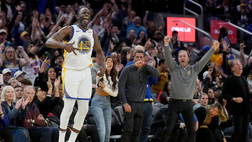 Draymond Green celebrates a three-pointer.