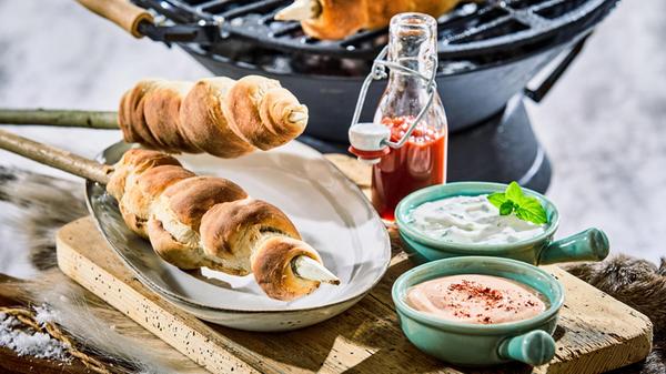 Winter barbecue with grilled twist bread on wooden