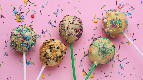 Delicious confectionery. Sweet cake pops and sprin