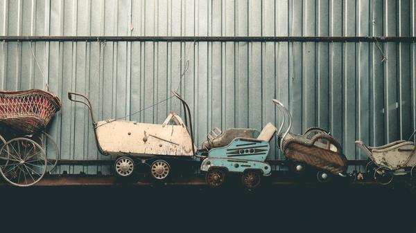 Old worn out strollers Collection of very old worn