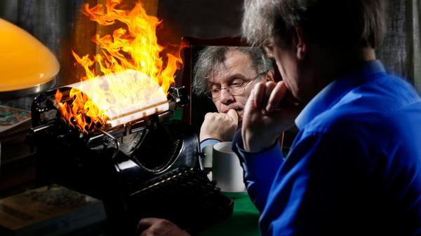 The author writes a book on fire on a pri