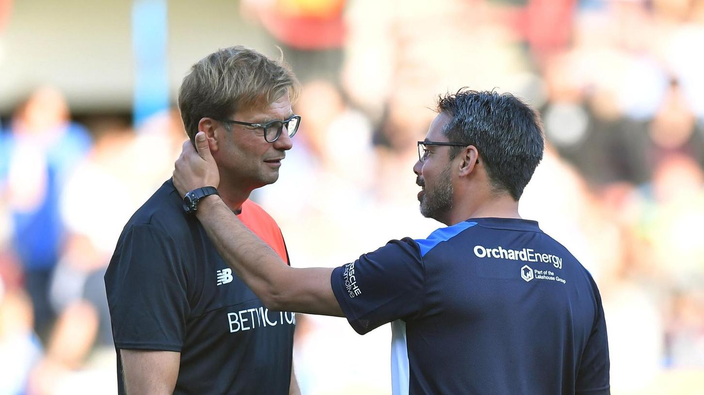 Der ehemalige Liverpool-Trainer Jürgen Klopp wird David Wagner, einst Coach bei Huddersfield Town, nun öfters sehen bei RB Leipzig. Der ehemalige Liverpool-Trainer Jürgen Klopp wird David Wagner, einst Coach bei Huddersfield Town, nun öfters sehen bei RB Leipzig.