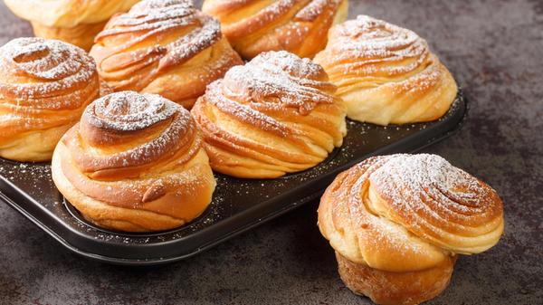 Homemade pastries cruffins, muffin with sugar powd
