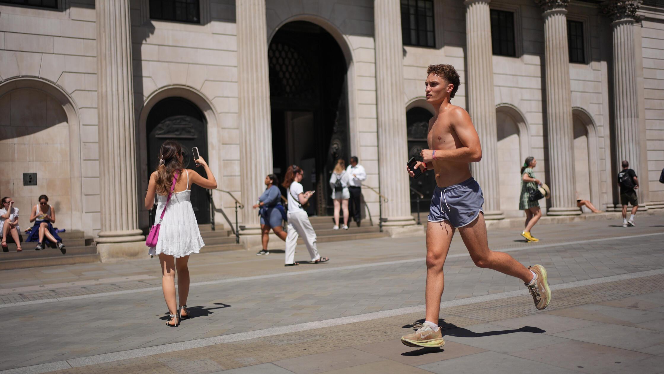 Summer weather July 11th 2025. A man jogging outsi