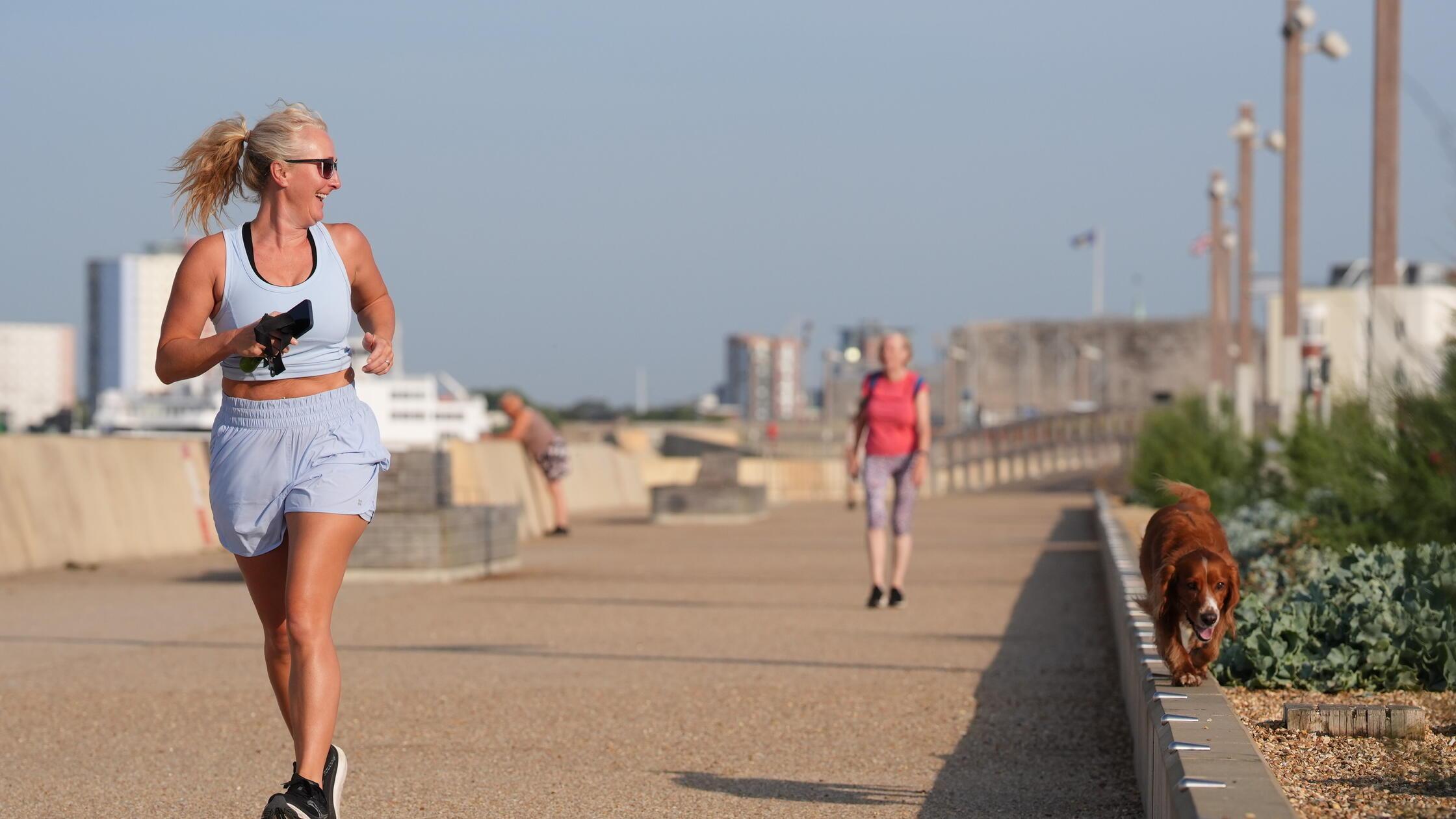 Summer weather Aug 12th 2025. A woman running with