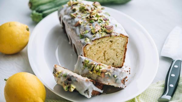 Lemon zucchini cake with lemon icing and pistachio