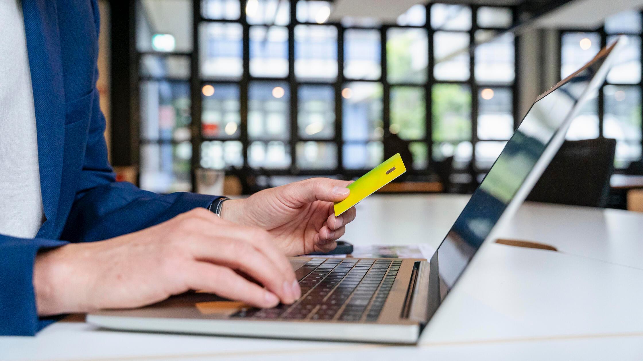 Businessman making online payment with credit card