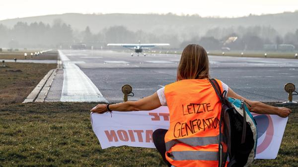 8 August 2024: Symbolic image, activist with high-