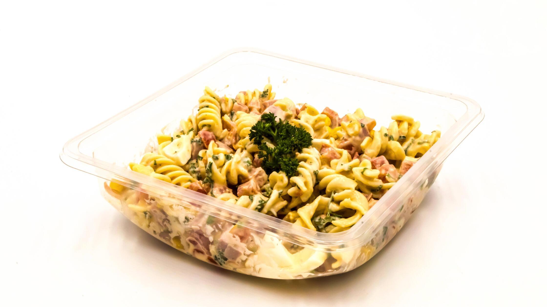 Tray of pasta salad on a white background , 300455