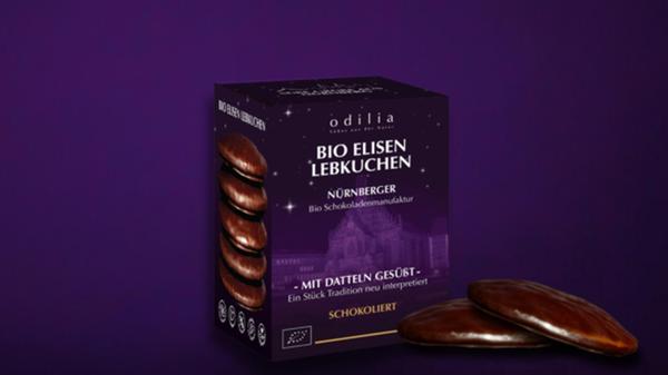 Platz 1: Ob Bio-Dattel-Schokolade, Bio-Dattel-Pralinen oder auch Bio-Elisen-Lebkuchen: im Nürnberger Schokoladengeschäft Odilia<b> dreht sich alles um die Dattel. Für Veganerinnen und Veganer geht dort das Herz auf, denn alle Produkte sind ausschließlich aus pflanzlichen Zutaten hergestellt. Dass das Konzept aufgeht, hat sich nun erwiesen: 2.179 Stimmen gab es für das Odilia-Team und somit den ersten Platz unseres Votings um den leckersten Lebkuchen der Region.</b>