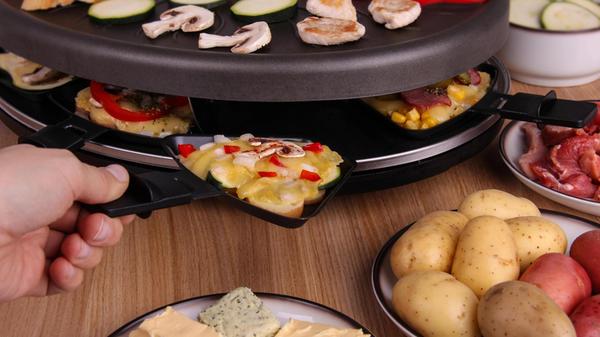 Female hand preparing raclette