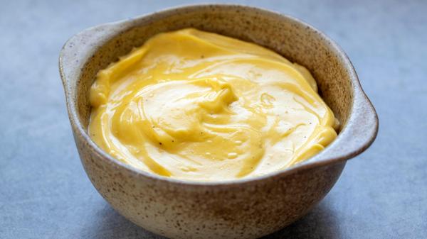 Homemade mayonnaise in a stoneware dish