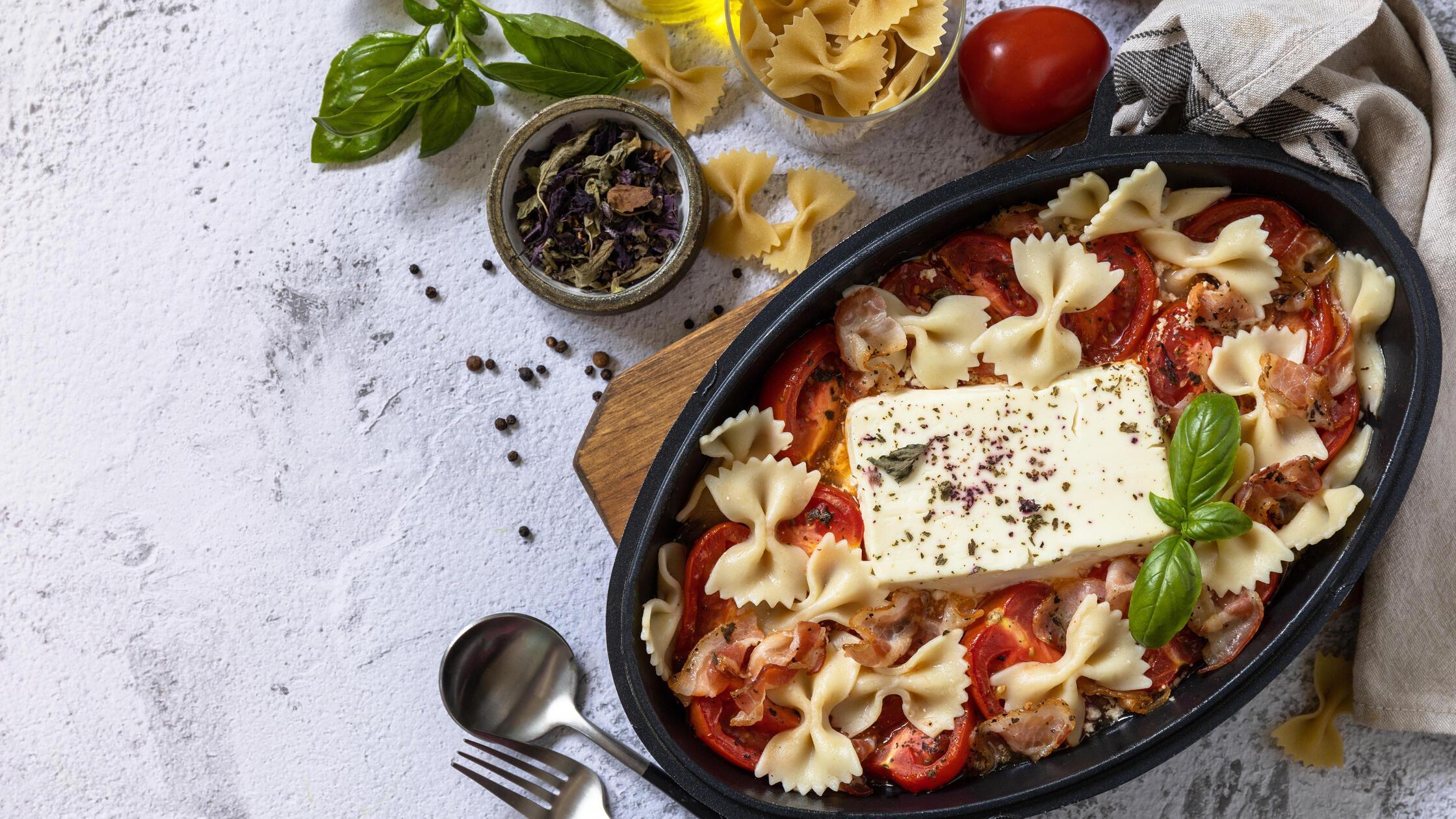 Baked feta pasta, or Tiktok pasta on gray backgrou
