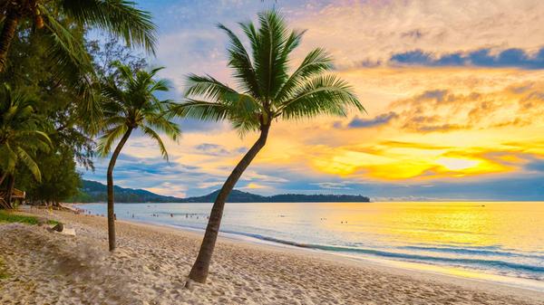 Bang Tao Beach during sunset in Phuket Thailand, p