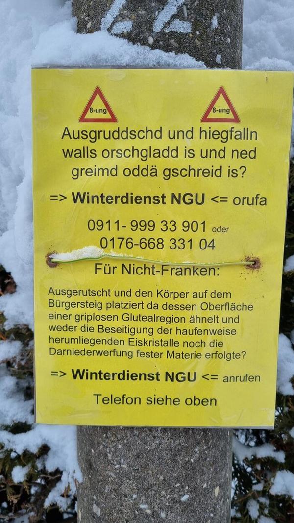 Schlecht gräumt? Dieser Hinweiszettel an einem Laternenpfahl informiert auf Fränkisch und Hochdeutsch, wohin sich die Bewohner des Stadtteils Herrnhütte wenden können.