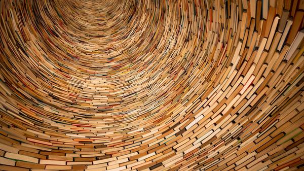 Huge pile of books stacked on each other