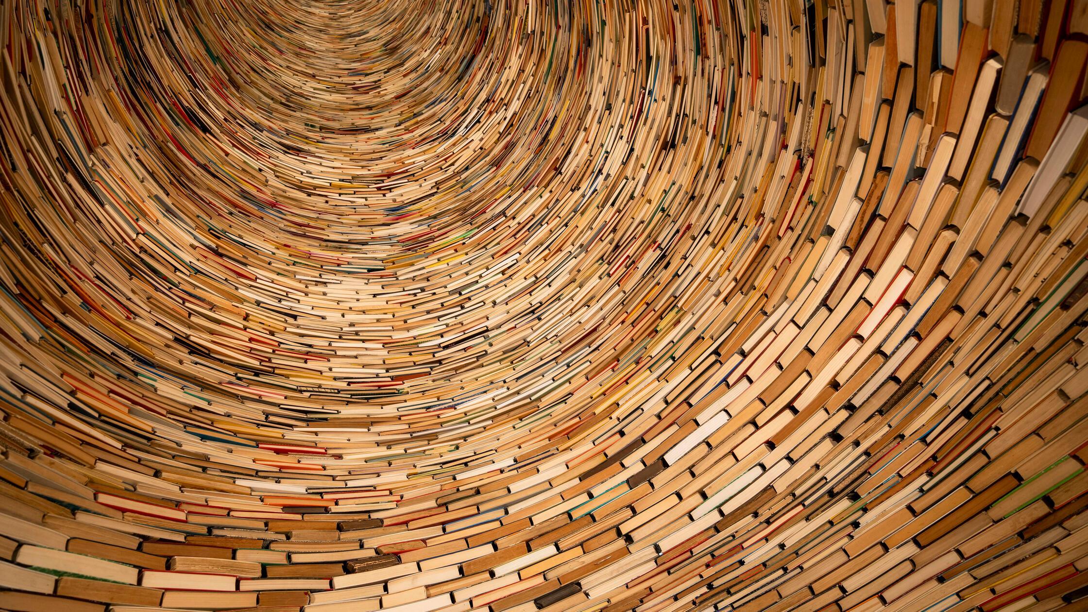 Huge pile of books stacked on each other