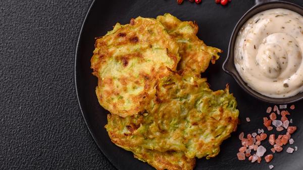 Vegetable zucchini fritters with garlic, salt, spi
