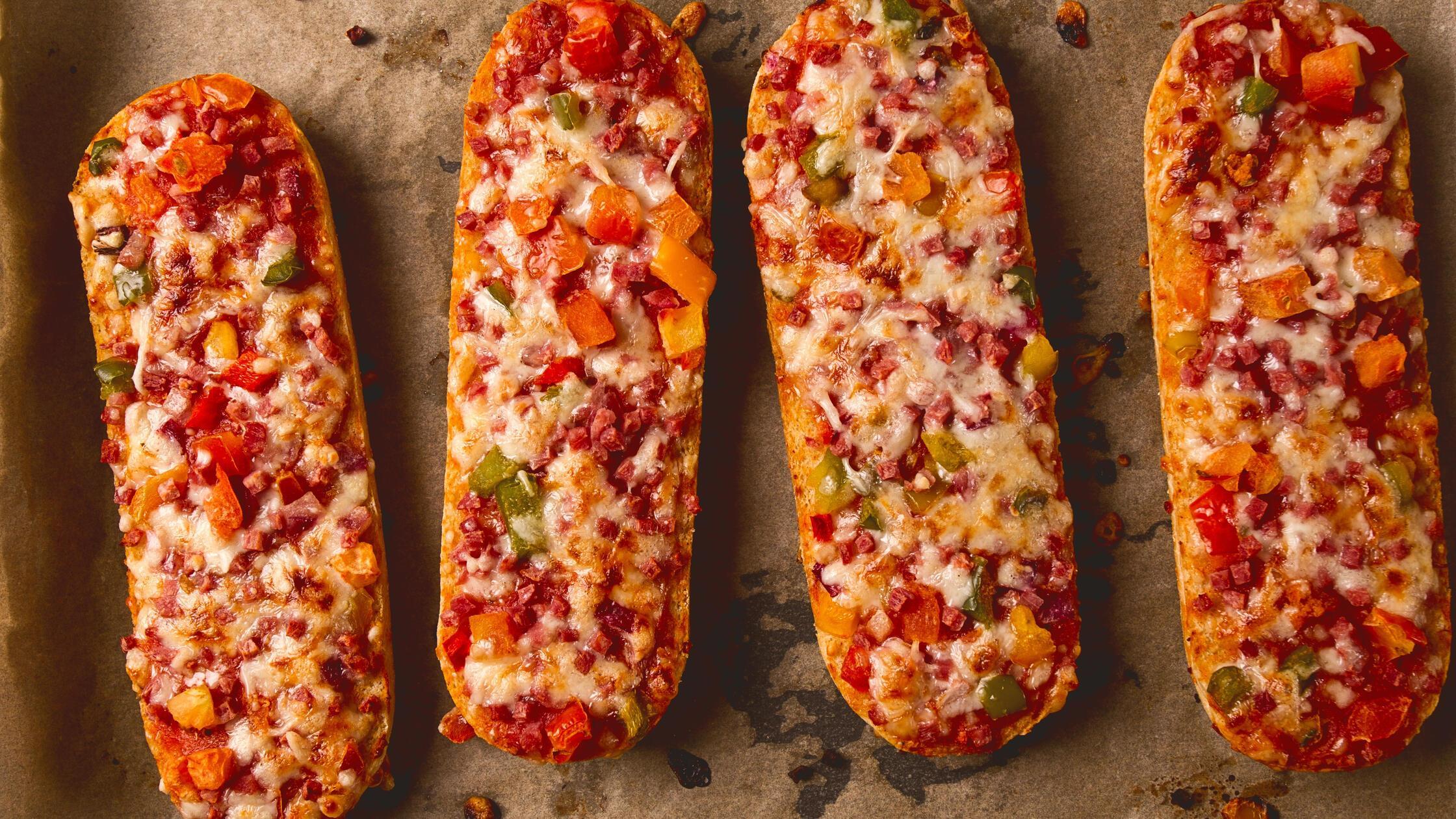 Pizza on a baguette, top view, close-up, no people