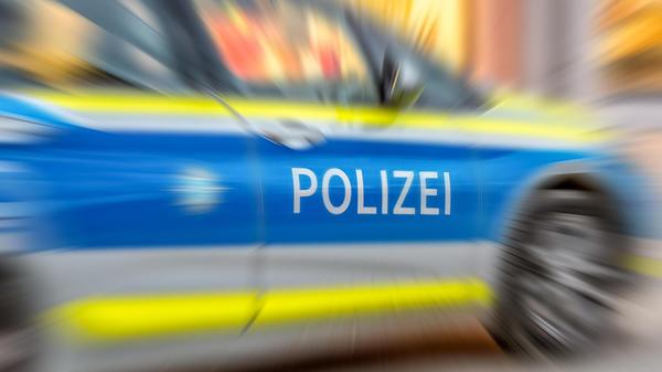 Motion blur of German police car with letters POLI