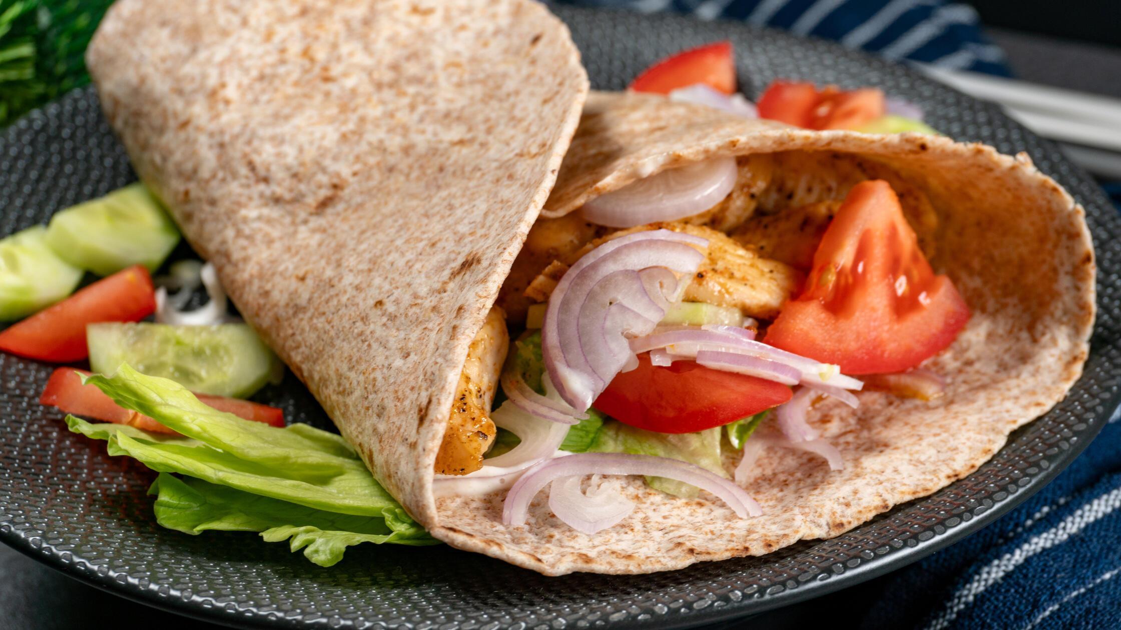 Wholegrain tortilla wraps with vegetables and chic