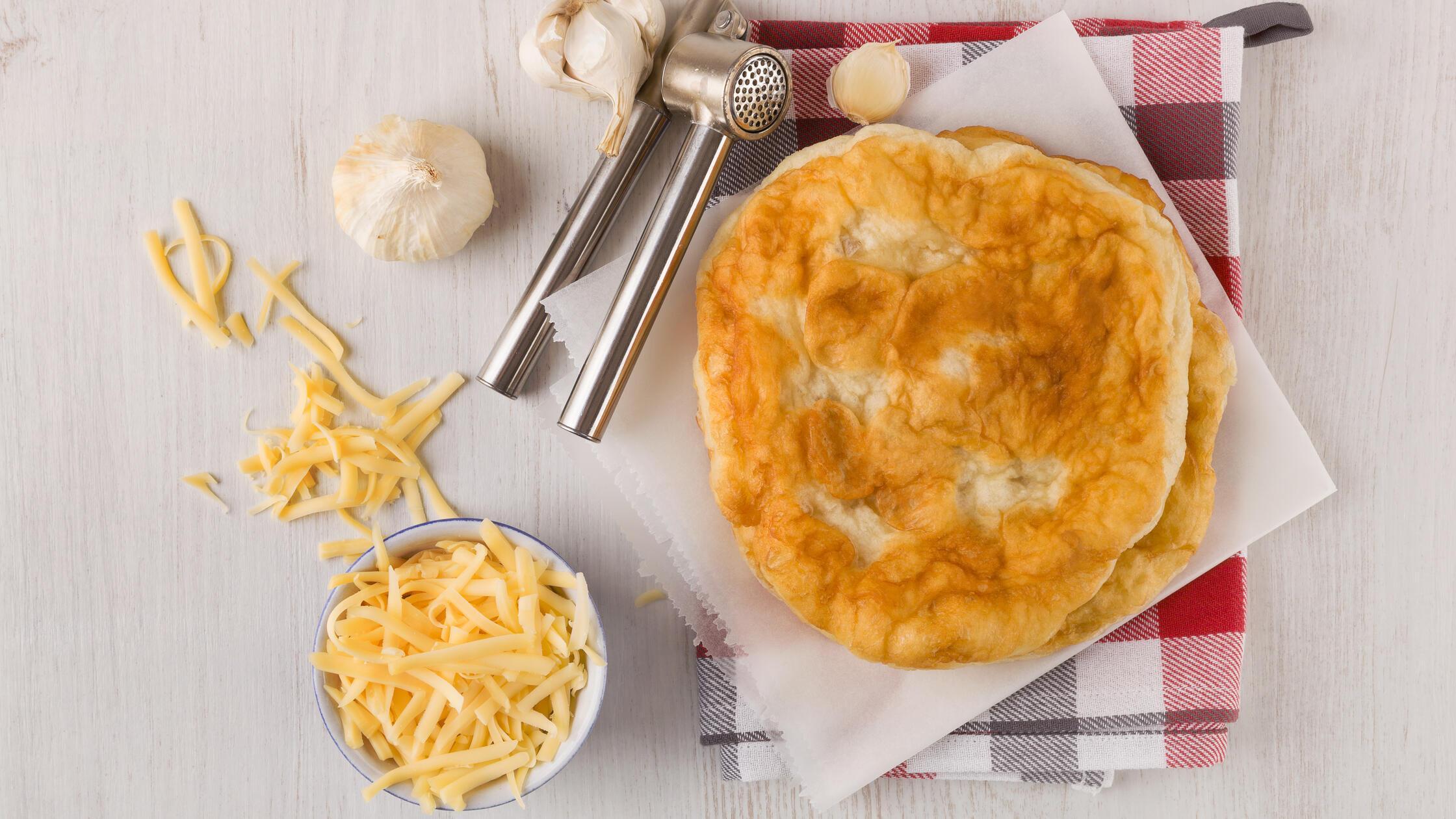 Delicious langos with grated cheese and garlic., 3