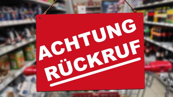 ACHTUNG RÜCKRUF, steht auf einem Schild vor einem
