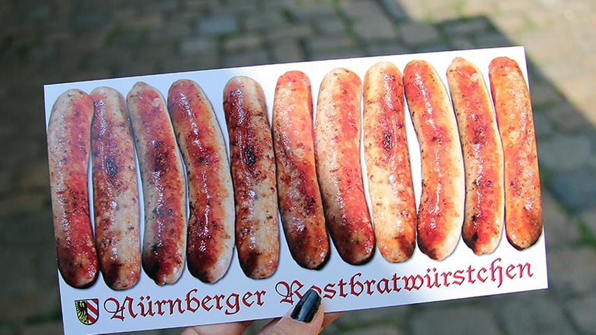 I weave my way in and out of the venues pausing only to pick up a few postcards. Bratwurst in Nuremberg are a must-have! If you have not tried them yet, the Handwerkerhof is the perfect place to order a famous Drei im Weckla.