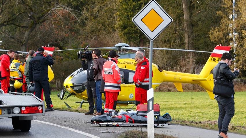 Helicopters of rescue services are seen at a field near Bad Aibling in southwestern Germany, February 9, 2016. About eight people were seriously injured and 12 more slightly hurt in a train crash in the southern state of Bavaria on Tuesday, German police said. REUTERS/Michael Dalder