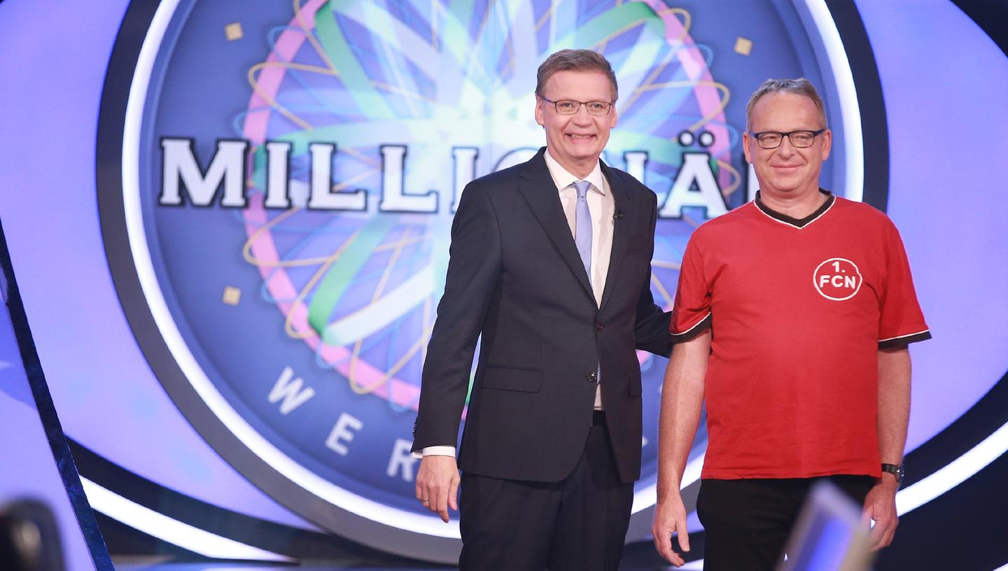 Siegerlächeln: Christoph von Seggern (rechts) ist Club-Fan und weiß, wie sich Erfolge anfühlen. Bei "Wer wird Millionär" fuhr er den nächsten ein: 125.000 Euro.
