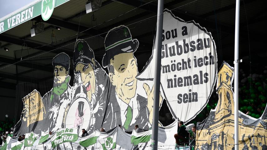 Männer mit grünen Schals und Krawatten, dazu ein paar Schweinchen: Die Botschaft ist klar.